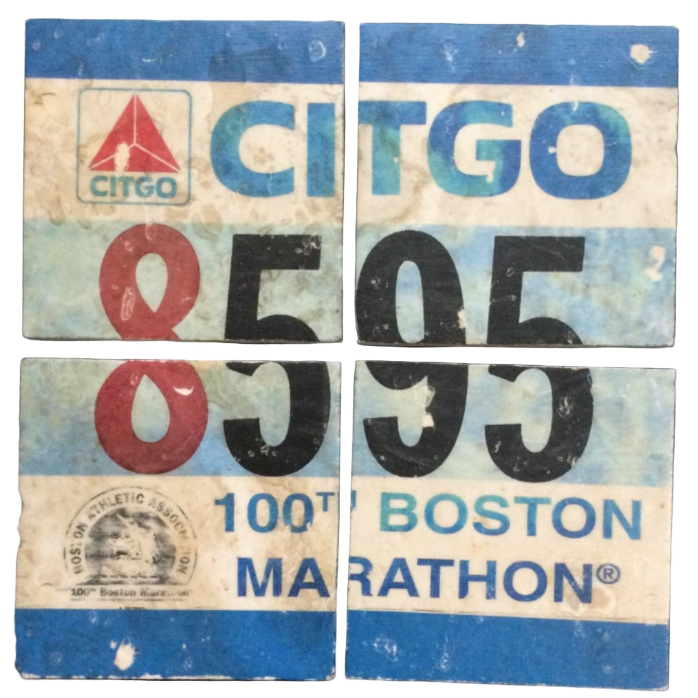 A set of four square coasters with rounded edges featuring graphic prints of a race bib with the CITGO logo and the text '100th BOSTON MARATHON'.